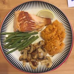 A picture of Salmon with sweet potato mash and vegetables.