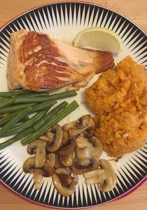 A picture of Salmon with sweet potato mash and vegetables.