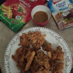 A picture of Traditional Taste French fries and onion pakoray.