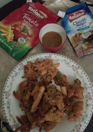 A picture of Traditional Taste French fries and onion pakoray.
