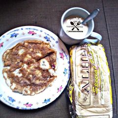 A picture of Tea and bread with fried egg.