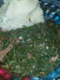Green mixed up with red meat and ugali