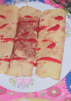 A picture of Semolina with tomato sauce burritos.