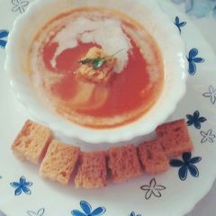 A picture of Carrot and tomato soup.