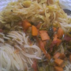 A picture of Spaghetti and fried cabbage.