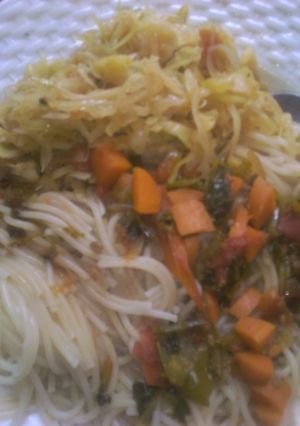 A picture of Spaghetti and fried cabbage.