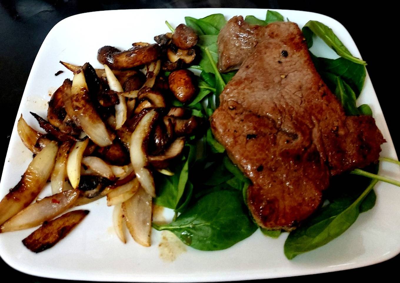 My seasoned rubber steak with mushroom peppers + onion