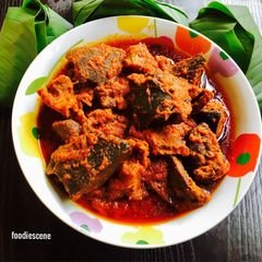 A picture of Assorted Meat stew and Leaf Rice.