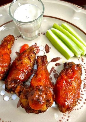 Una foto de Alitas en salsa de mango habanero y paprika