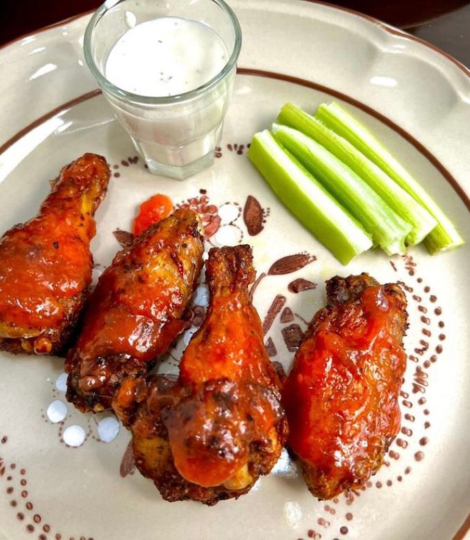 Una foto de Alitas en salsa de mango habanero y paprika