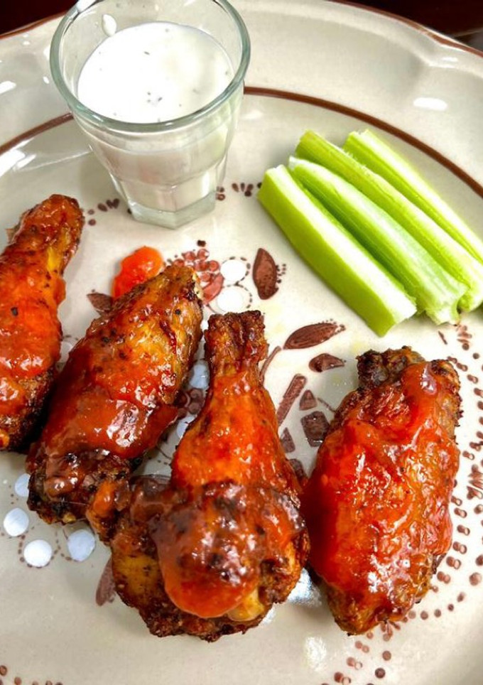 Una foto de Alitas en salsa de mango habanero y paprika