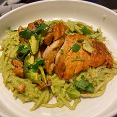 A picture of Green Mexican pasta with grilled seasoned chicken.
