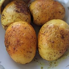 A picture of Boiled eggs pan fried WD tumeric powder.