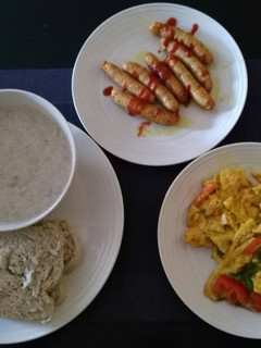 A picture of Bread,Fried egg with sausage with tea.