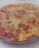 Tortilla de tomate solis, nata, y queso rallado