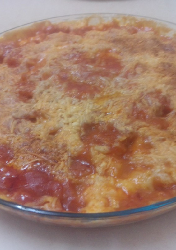 Una foto de Tortilla de tomate solis, nata, y queso rallado