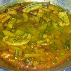 A picture of Ilish dimer makha chochchori/Spicy vegetables with Hilsa egg.
