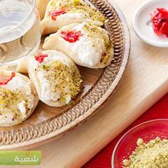 A picture of Pancakes stuffed with ashta cream - atayef bi ashta.
