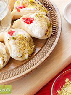 A picture of Pancakes stuffed with ashta cream - atayef bi ashta.
