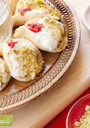 A picture of Pancakes stuffed with ashta cream - atayef bi ashta.