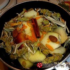 A picture of Greek mountain tea with apple, cinnamon and orange.
