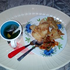 Fried yam & vegetables sauce with black tea(break fast) A picture of Fried yam & vegetables sauce with black tea(break fast).