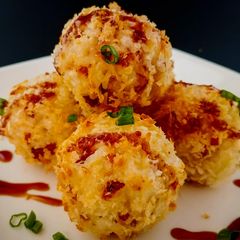 A picture of Cheesy bacon and rice croquettes.