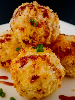 A picture of Cheesy bacon and rice croquettes.