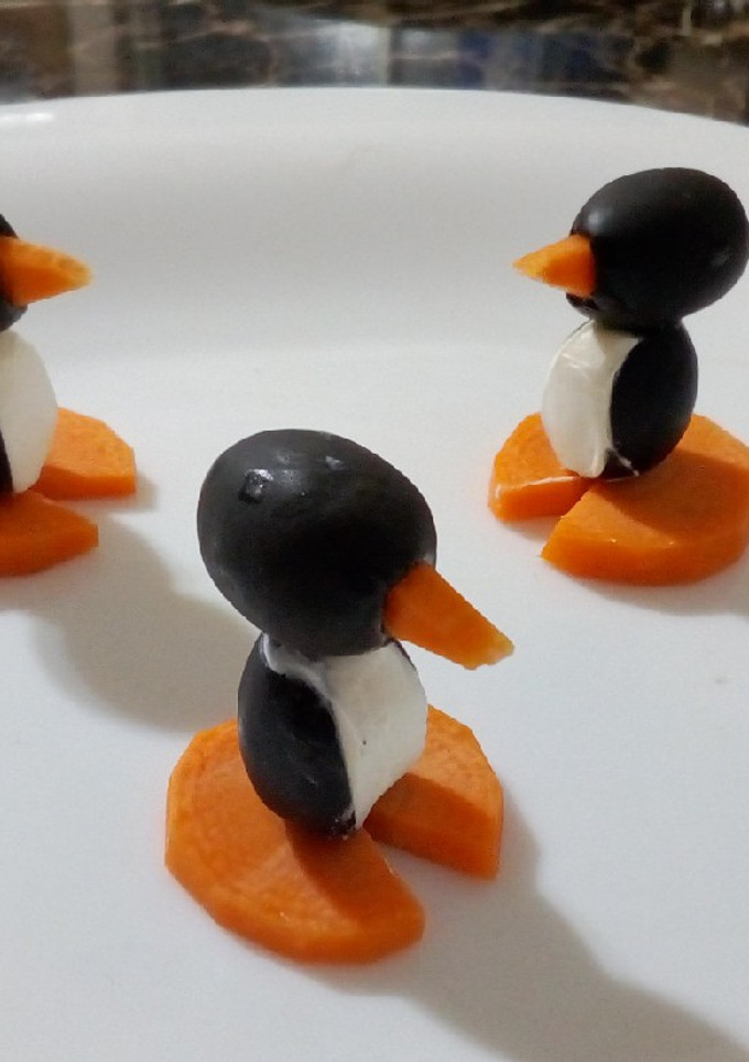 Una foto de Pinguinos de aceituna negra con philadelphia y zanahoria