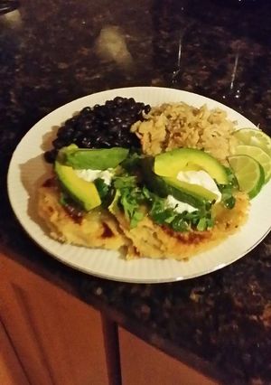 A picture of Brad's pupusas de rajas with frijoles negro and Arroz verde.