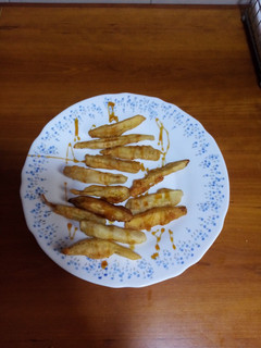 Una foto de Bastoncillos de berenjena con miel en tempura de cerveza