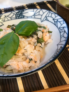 A picture of Salmon Sushi with Fresh Basil.