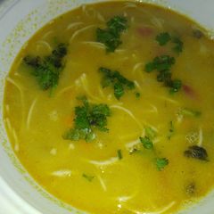 A picture of Corn soup with chow mein.