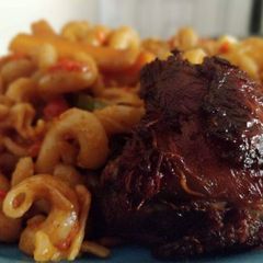 A picture of Macaroni with fried meat.