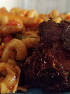 A picture of Macaroni with fried meat.