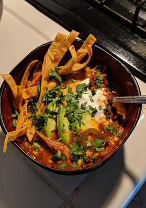 A picture of Pulled pork tortilla soup.