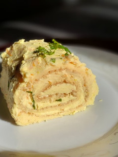 Una foto de Brazo gitano con crema de naranja