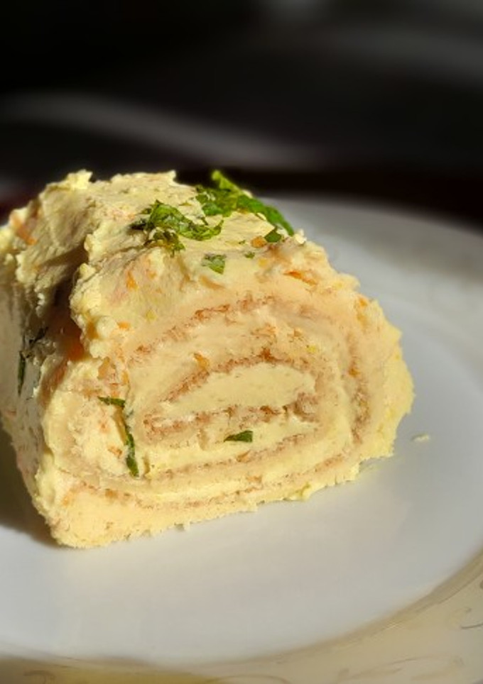 Una foto de Brazo gitano con crema de naranja