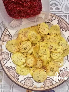 A picture of Homemade Potato Chips with sprinkled spices.