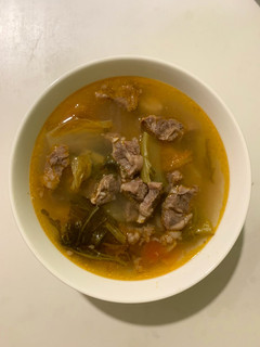 A picture of Beef Stew with Pickled Mustard Greens.