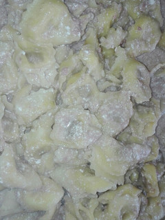 Una foto de Cappelletti con prosciutto crudo (pasta rellena)