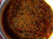 A picture of egusi soup with tomatoes