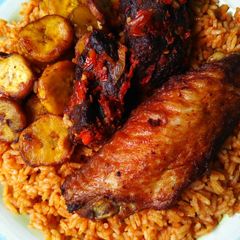 A picture of Jollof rice,fried olantain and fried turkey.
