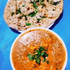 A picture of Butter naan with Paneer Makhni.