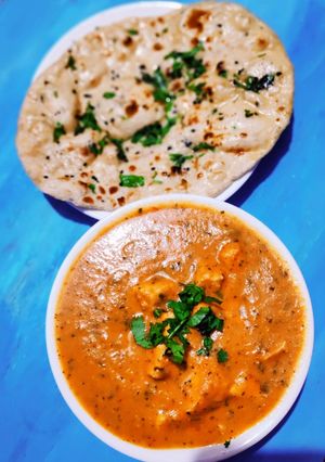 A picture of Butter naan with Paneer Makhni.
