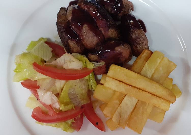 Recipe of Perfect Medium-well done steak having red sauce, French fries and salad