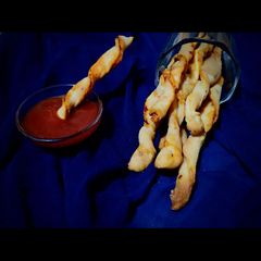 A picture of Tea Time Schezwan Twisties.