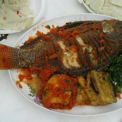 A picture of Fried Fish with Sautéed Kales.