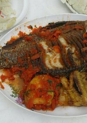 A picture of Fried Fish with Sautéed Kales.