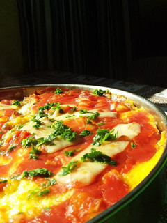 Una foto de Polenta rellena con salsa blanca